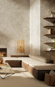 Warm contemporary living room featuring Caesarstone quartz wall cladding in a soft beige tone. The design blends natural textures, subtle lighting, and earthy materials to create a serene and elegant atmosphere.